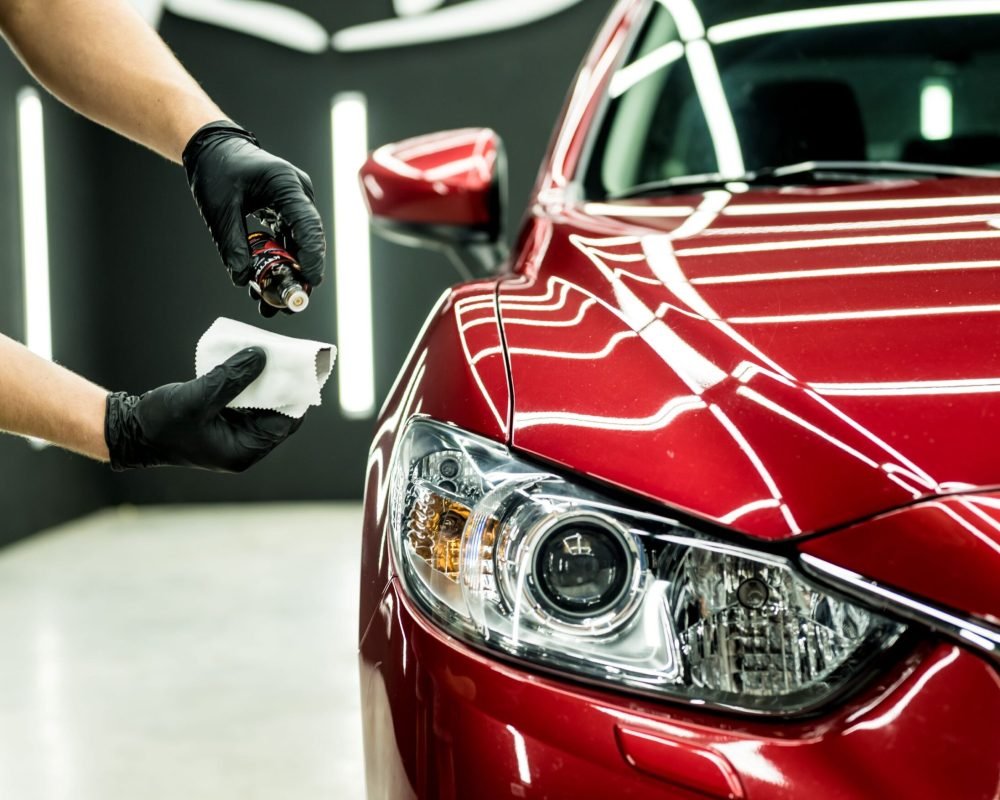 car-service-worker-applying-nano-coating-car-detail